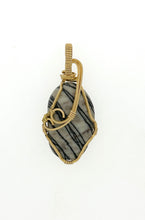 Load image into Gallery viewer, Polished Picasso Stone pendant wrapped in brass wire.