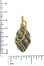 Load image into Gallery viewer, Polished Picasso Stone pendant wrapped in brass wire.